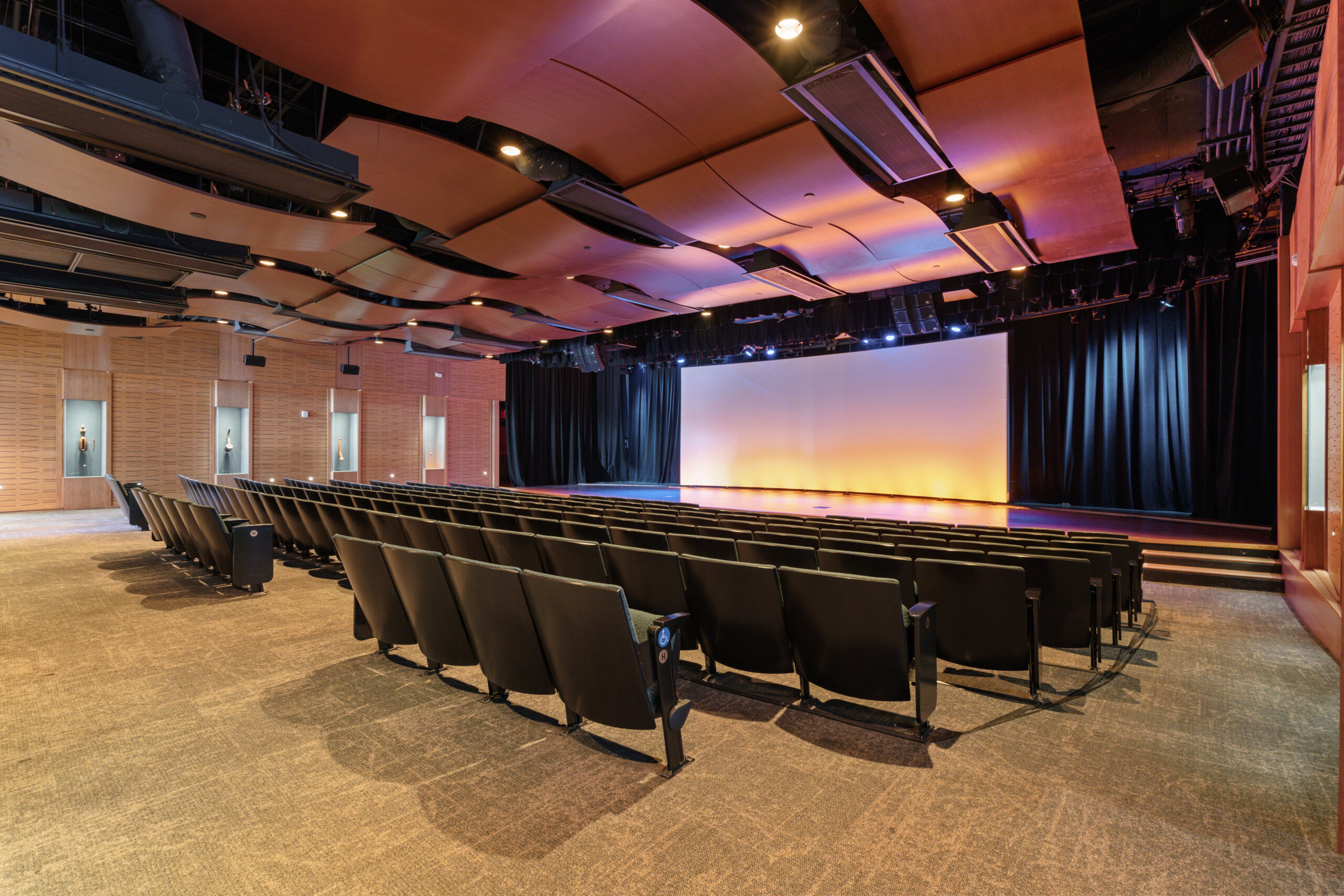 Empty Roots Theater at the National Museum of African American Music, facing the stage and projection screen